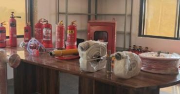Fire safety equipment on a table indoors.