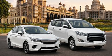 Two white cars parked in front of a historical building in Bangalore.