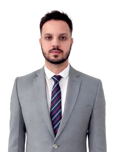 Man in gray suit and striped tie against a white background.