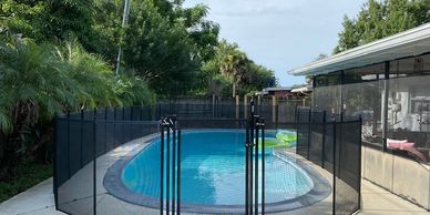 A Life Saver Pool Gate added to the Pool Safety Fence provides easy access to the pool.