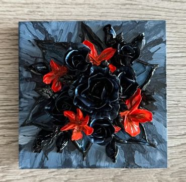 A dark square artwork featuring black roses with vibrant orange flowers on a textured background.