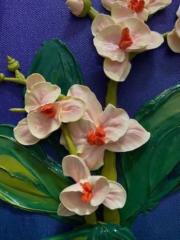 A painting of white orchids with orange centers and green leaves on a dark purple canvas.