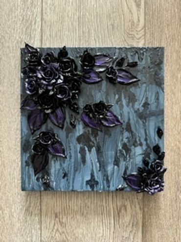 A dark square artwork featuring black roses and deep purple leaves on a textured background