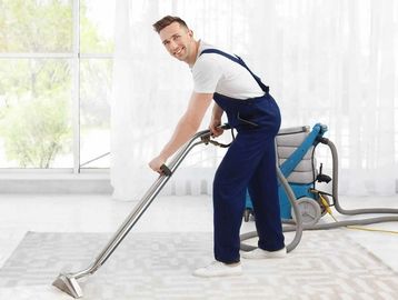 Man cleaning carpet