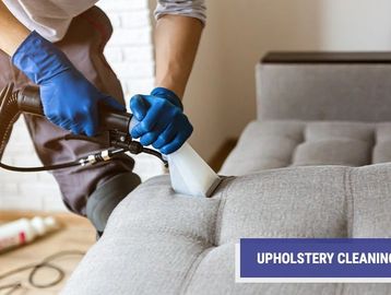 Man cleaning upholstery