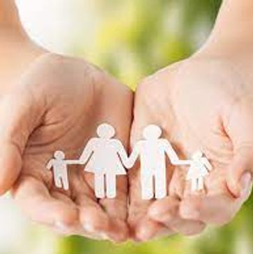 Hands holding paper cutout of a family symbolizing care and protection.