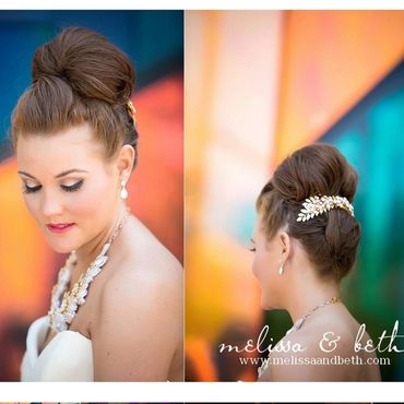 Elegant bridal hairstyle with intricate updo and pearl accessories.