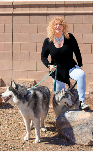 A woman and two dogs