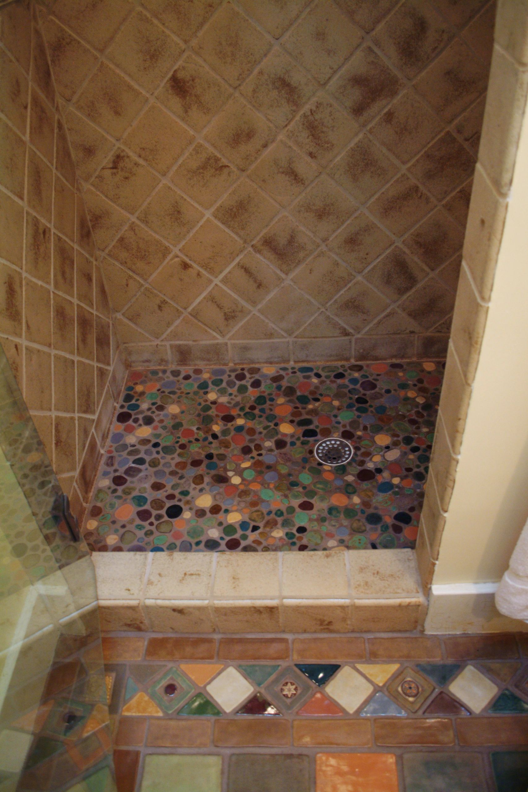 Seneca Tile combined wth Laurie's "river-rock" tile. Bathroom floor patterned with Laurie Eisenhardt