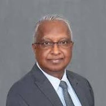 Professional man in suit and tie with glasses.