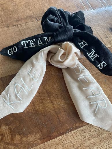 Personalizing hair ties with names, sports, and initials for your team or as a gift.