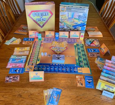 Strike It Rich board game set up on a table ready to play.