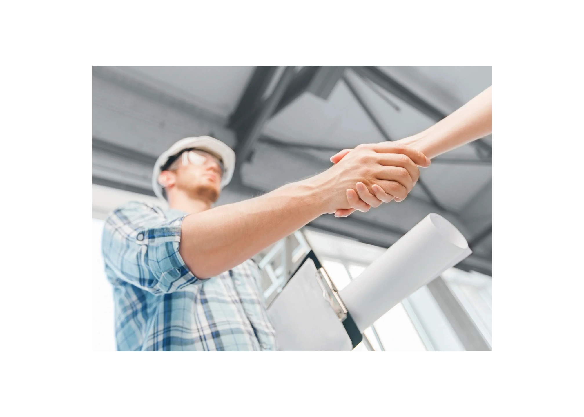 A handshake between the contractors and the client.