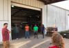 Brief team meeting before volunteers of One Pearland and PRAT ONE come together to unload truckloads of supplies from all over the US.