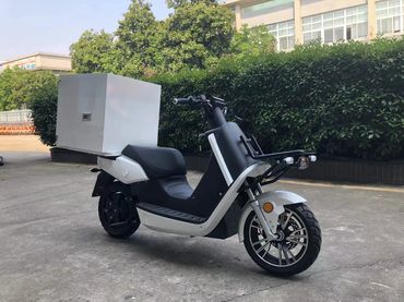 A heavy-duty cargo electric motorcycle with a big cargo box