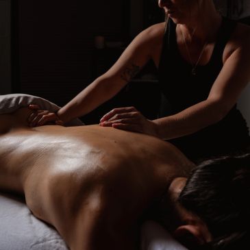 Person receiving a relaxing back massage.