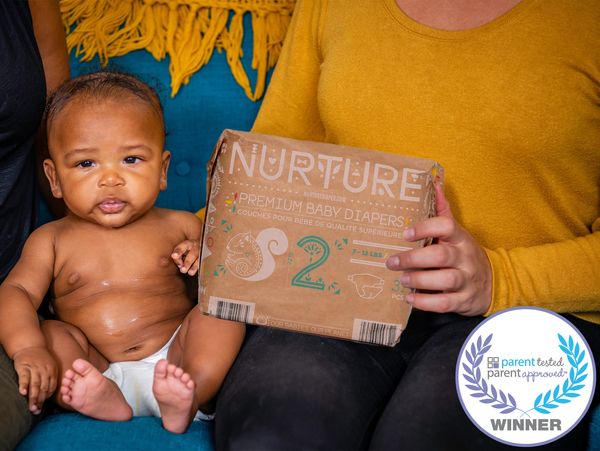 Baby wearing compostable baby diaper
