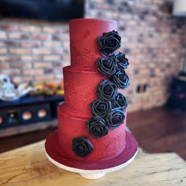 Red and black 3 tiered cake