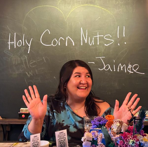 One of our regular guests with a quote she said drawn on the chalkboard behind her