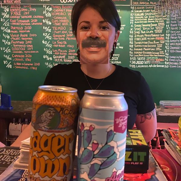 Bartender (and National Treasure) Tiffany featuring a dark lager beer and a cold IPA beer