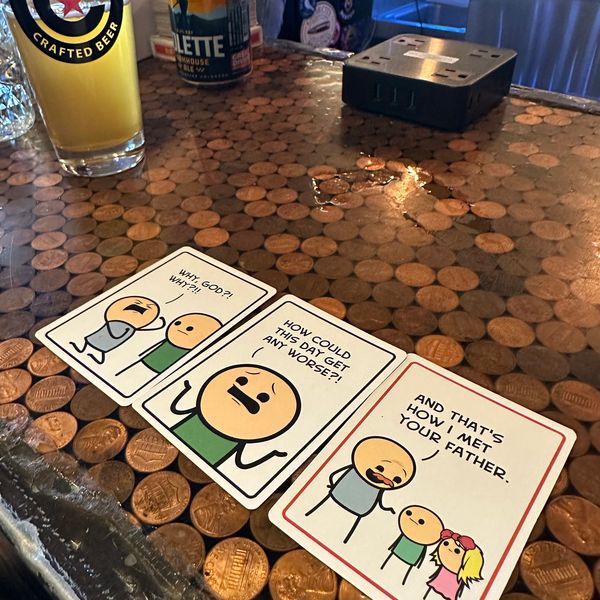 3 panels of the game Joking Hazards with a glass of beer