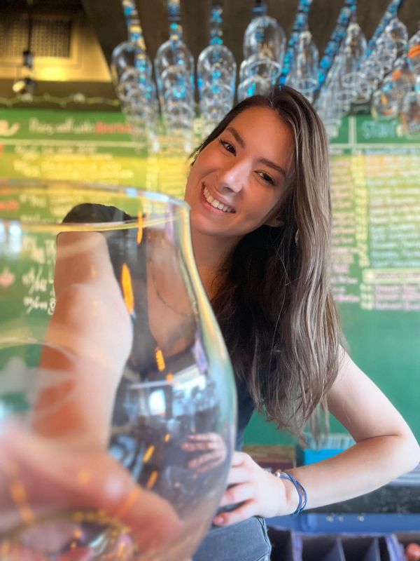 Bartender Amanda ready to pour you a beer, wine, cider, seltzer, mead, or non-alcoholic drink