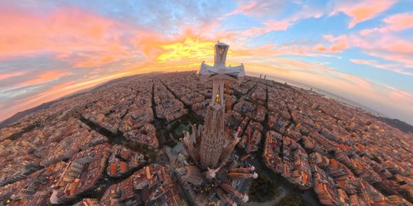 Aerial view of Sagrada Família with sunset sky.
