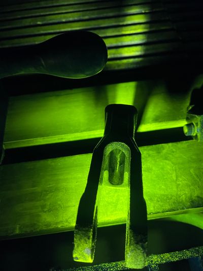 ASTM E1444 part under inspection for ferromagnetic flaws.