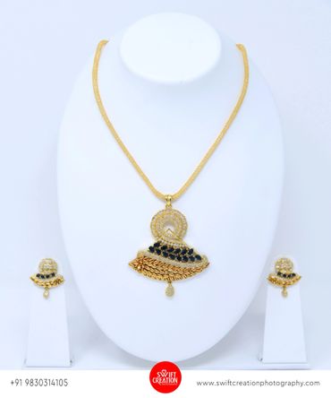 gold jewelry presentation on a white mannequin stand, jewellery photo