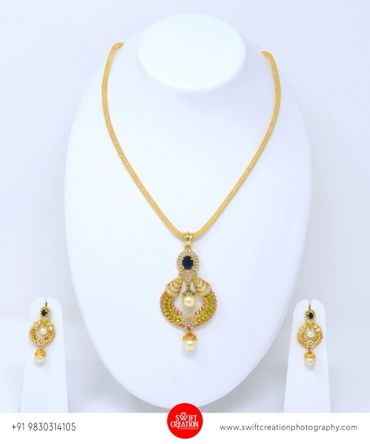 golden jewelry display on a white mannequin stand, jewellery images