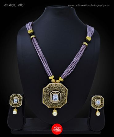 jewellery display on a black mannequin stand, jewellery photography