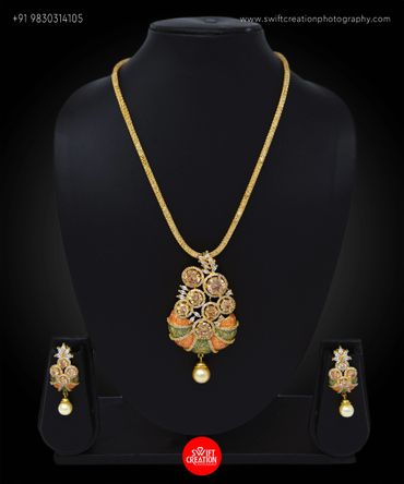 necklace set display on a black mannequin stand