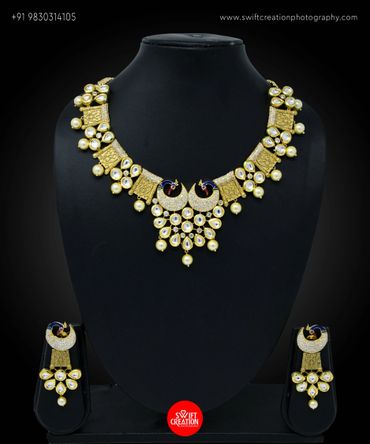 necklace display on a black mannequin stand