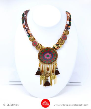 handmade jewelry display on a white mannequin stand, jewellery photoshoot