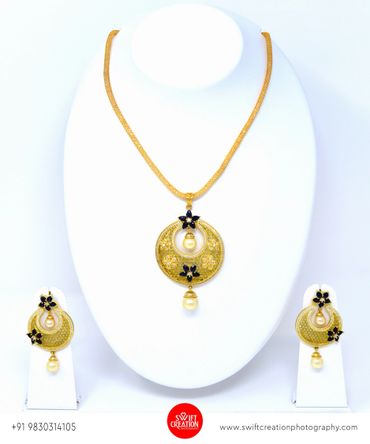 half moon golden jewelry display on a white mannequin stand