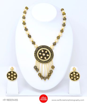 luxury jewellery set on a white stand, jewellery photography kolkata