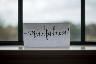 a piece of paper with the word mindfulness on it