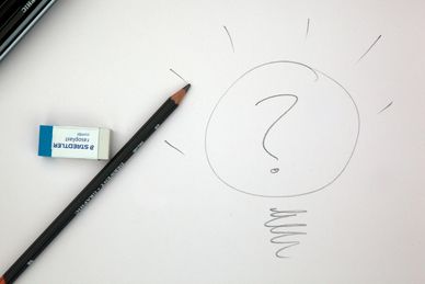 a piece of paper with a question park, a pencil and an eraser
