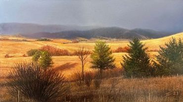 a small realist landscape of golden plains and fir tress and distant hills