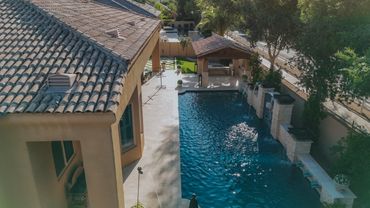 Chandler backyard with paver patio and evening lighting