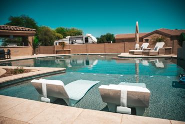 Rebuilt outdoor space with BBQ, water, and paver flooring