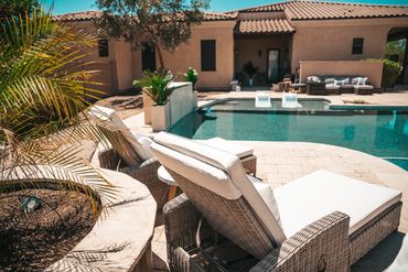 Backyard patio with built-in BBQ and desert landscaping