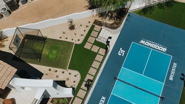 Backyard entertainment space with native plants and walkways