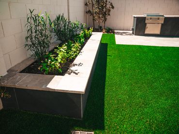 Modern Gilbert outdoor renovation with shade and planter boxes