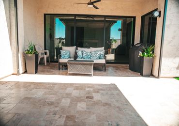Outdoor living space with shade and desert plants