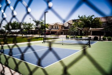 Neighborhood pickleball court with shaded benches