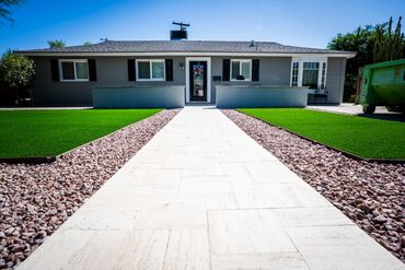 Front yard with desert textures and structured stonework