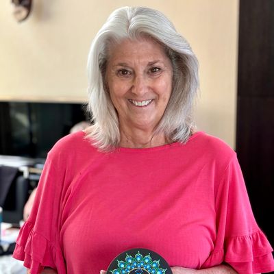 Melissa finds joy in the fellowship and relaxation that dot painting brings. Her favorite creation s