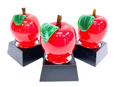 blown glass apple awards on wood bases