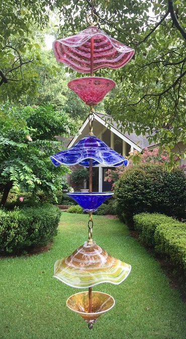 Birdseed feeders made from blown glass